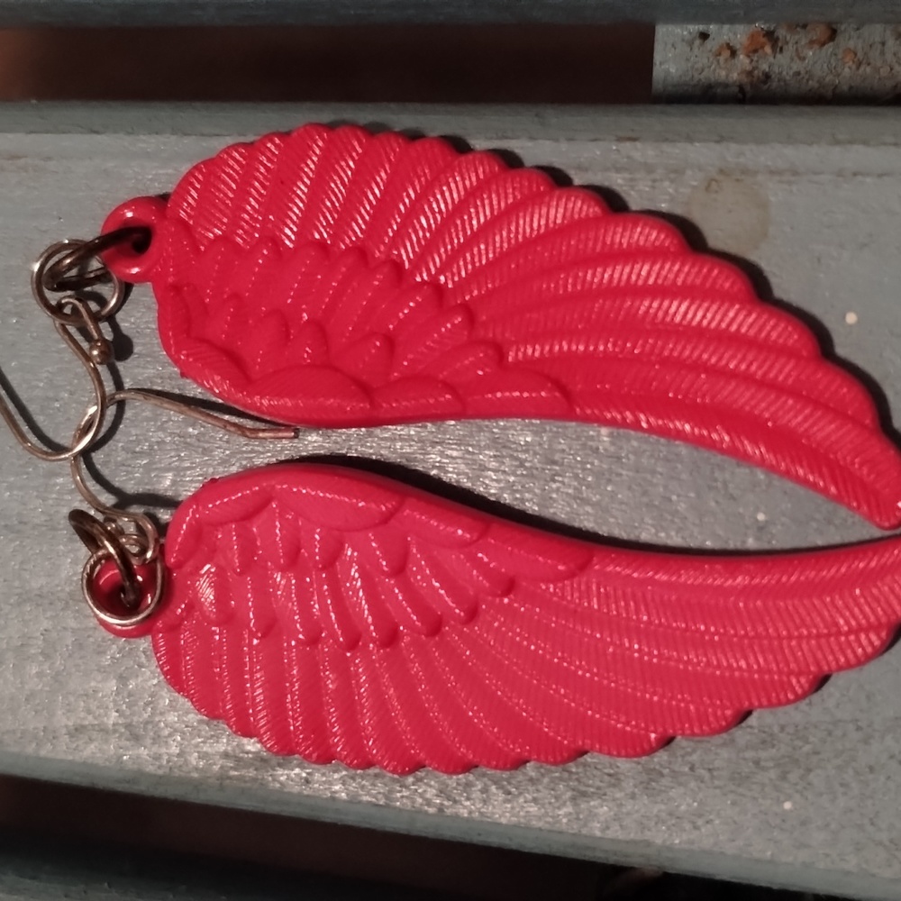 Pink angel wings earrings with a fishback hook